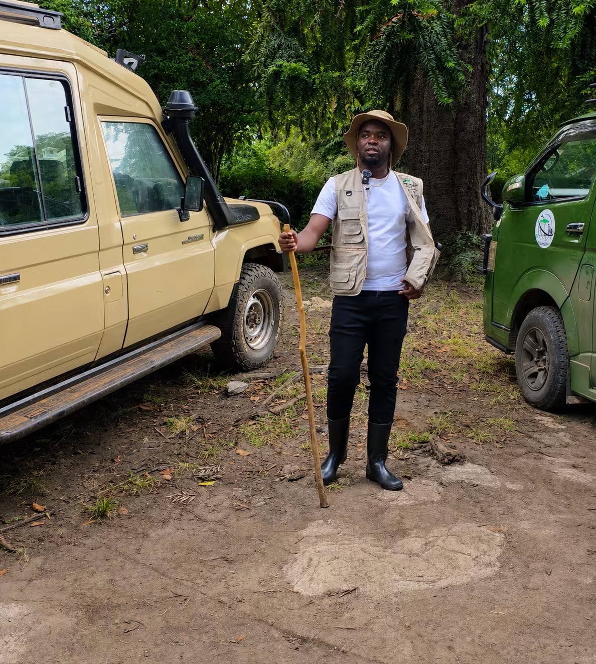 Ibrahim, IZ Agency co-founder, with the safari vehicles at a forest trailhead